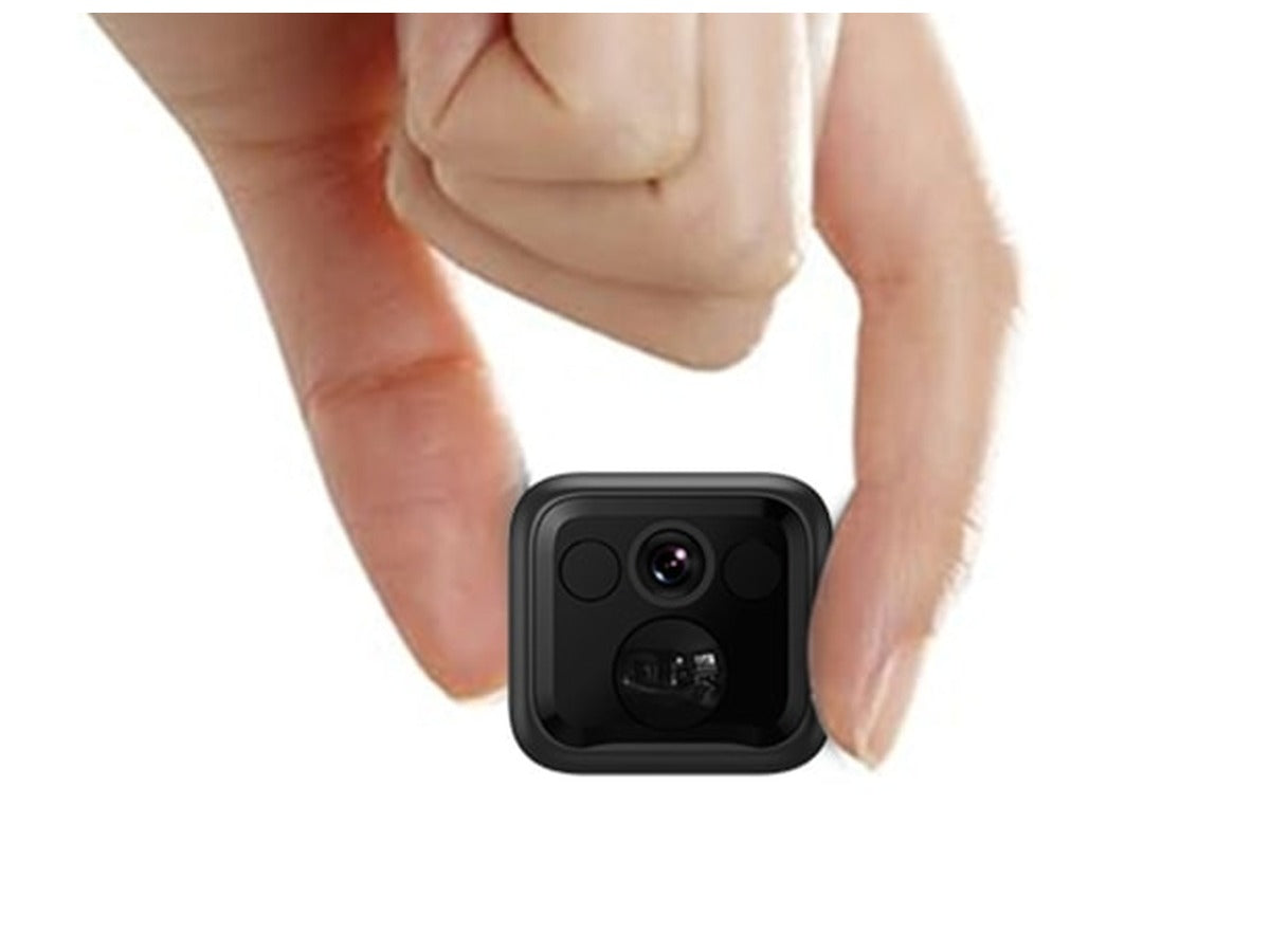 Lexuma XCAM mini security camera held between two fingers